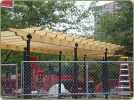 the crew erecting the trellis in Washington market Park, NY