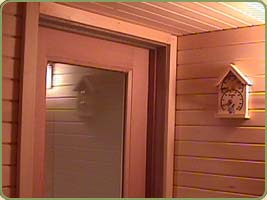 yellow cedar interior paneling covering a sauna