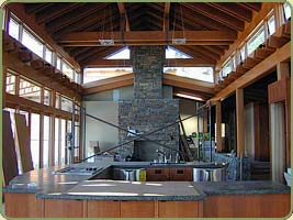 a kitchen and living room with post and beams