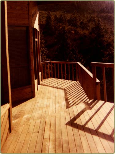 picture of a mountain home with a western red cedar deck