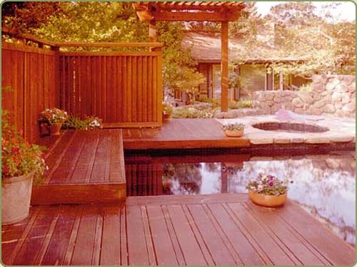 image of a redwood pergola, fence and deck