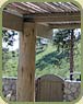 peeled log as a post and small rail as roof/shade material image