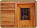 Cedar trim frames this window.