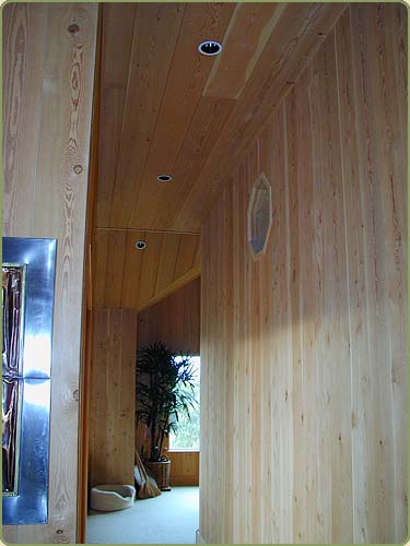 Image of a hallway with fir paneling