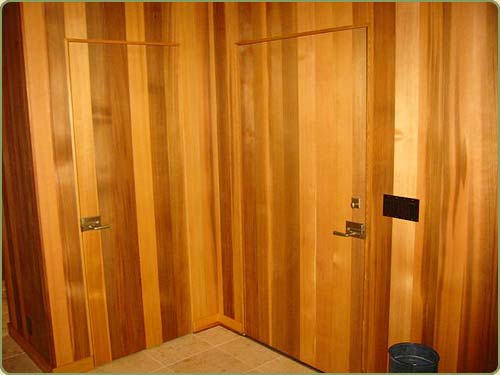 doors with western red cedar panels to match the walls.