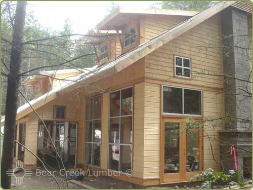 this home has a pattern 105 drop siding and shingles in yellow cedar