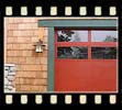 detail of the garage doors, trim and shingles