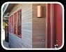 Thumbnail of a beach fence in weathered yellow cedar, and stairs leading to the home