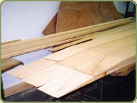 yellow cedar boards on a workbench