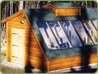 LOG CABIN SIDING USED ON THIS SMALL GEREENHOUSE
